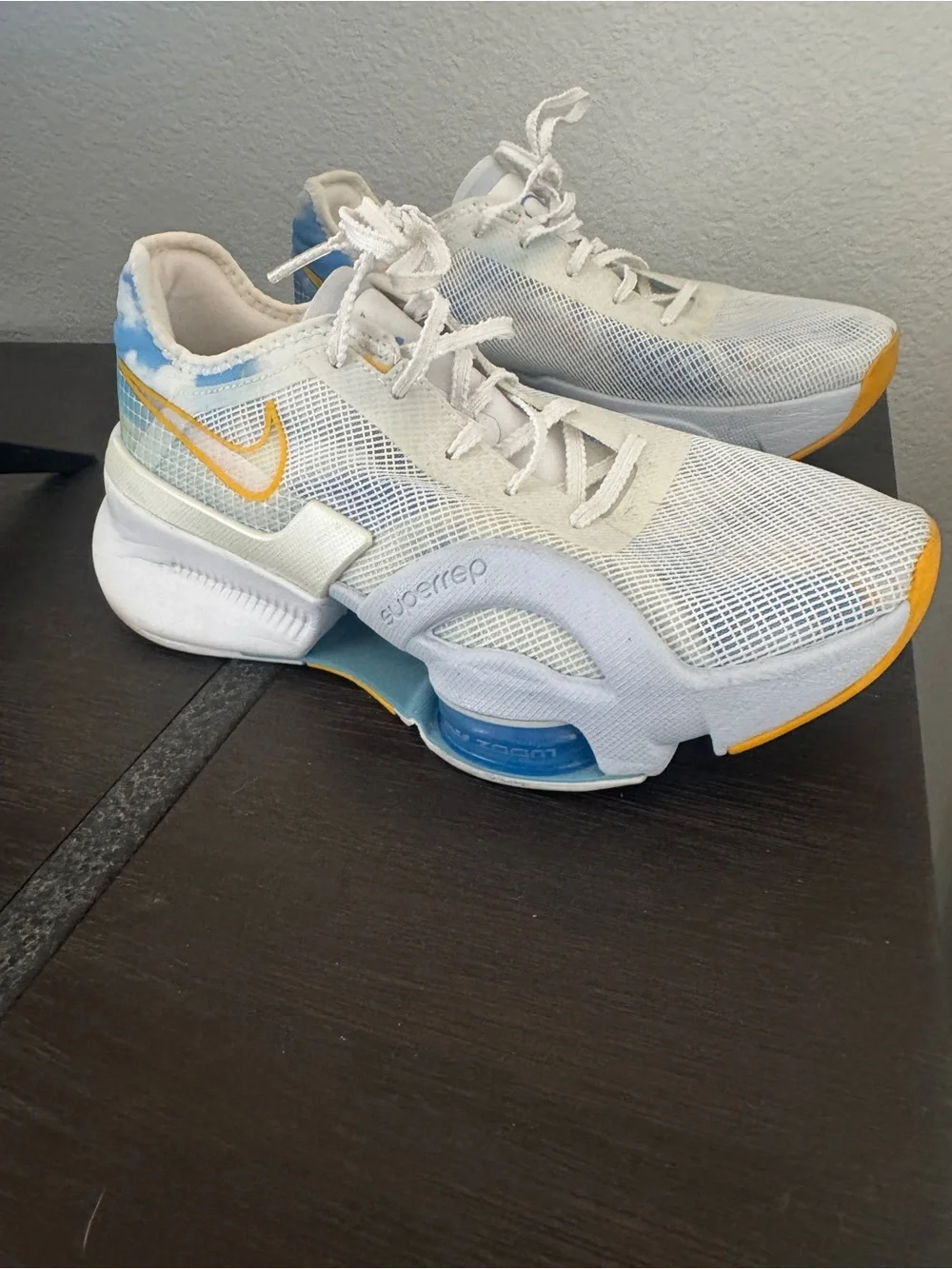 Nike White Mesh Sneakers with Blue and Yellow Accents